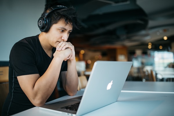 Professional working on laptop in modern office
